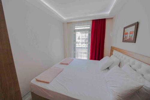 Ένα ή περισσότερα κρεβάτια σε δωμάτιο στο Asil Apart Hotel