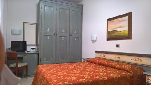 Letto o letti in una camera di Hotel Suisse
