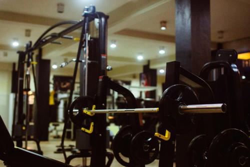 a gym with rows of dumbbells at Cozy Sea view Inn in Hikkaduwa