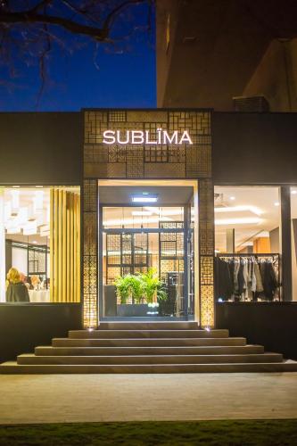 a sullivan store at night with stairs in front at Hotel New Skanpol in Kołobrzeg