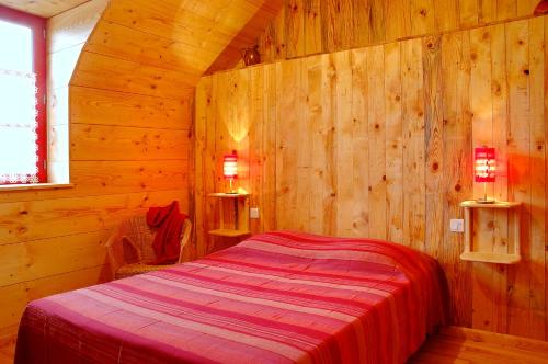 מיטה או מיטות בחדר ב-La Jameliniere