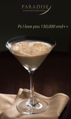 a drink in a martini glass sitting on a napkin at Paradise Saigon Boutique Hotel & Spa in Ho Chi Minh City