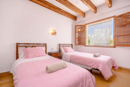 Ένα ή περισσότερα κρεβάτια σε δωμάτιο στο Pensión Bellavista