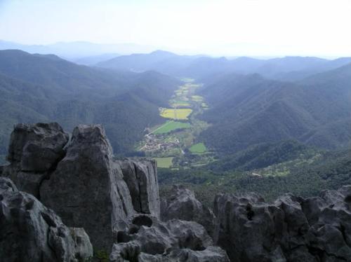 a view of a valley from the top of a mountain at La Farga de la Muga in Sant Llorenç de la Muga