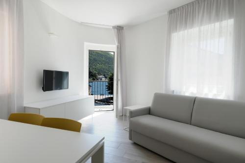 En tv och/eller ett underhållningssystem på Bertamini Apartments
