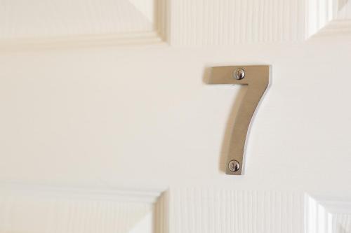 a number on a wall in a room at Wordsworth Apartment Irene court in Cockermouth