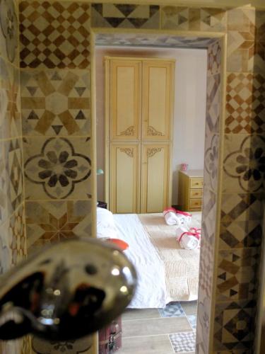 Una cama o camas en una habitación de Incanto delle Ninfe
