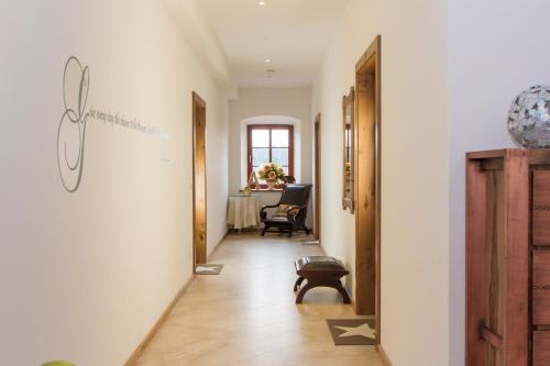 a hallway with a hallway leading to a room at Hotel Alpenblick in Riedering
