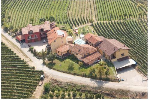 an aerial view of a large house in a vineyard at B&B Rumanot in Dogliani