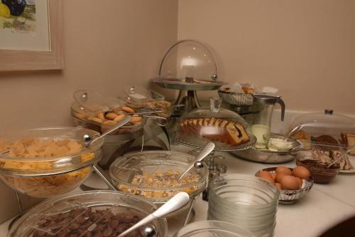 a counter topped with lots of different types of food at Hotel Galaxias in Agrinion