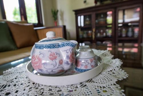 a tea set on a tray on a table at Phuttal Residence in Phra Nakhon Si Ayutthaya