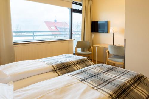 Un ou plusieurs lits dans un hébergement de l'établissement Guesthouse Sunna
