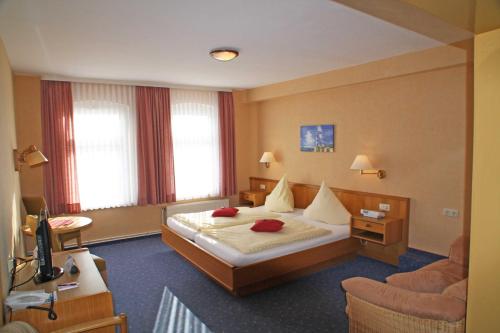 Postel nebo postele na pokoji v ubytování Hotel Vier Linden