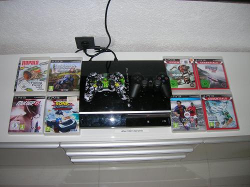 a shelf with games and video games on it at Appartement Fortuna in Saalfelden am Steinernen Meer