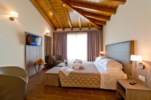 a bedroom with a large bed in a room at Villa Carolina Resort in Castelletto d'Orba