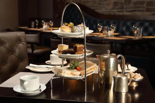 a table with a tray of food on a table at Golden Lion Hotel in Stirling