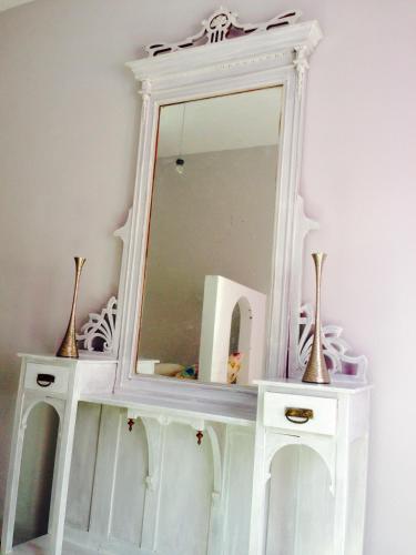 a white mirror on top of a white dresser at Heraklion Gortyn Phaistos House in Mitrópolis