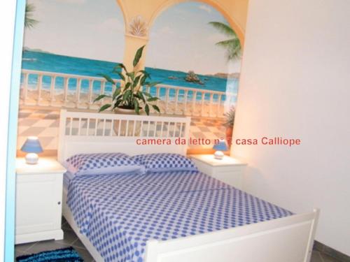 贾迪尼-纳克索斯Appartamenti Calliope e Silvia, Giardini Naxos的一间卧室配有一张床,并画着海洋