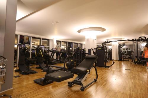 a gym with treadmills and cardio equipment in a building at DubaiVillage in Camposano