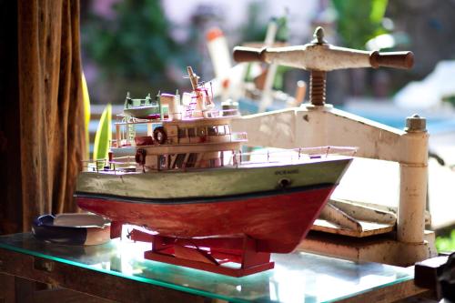 a toy boat is sitting on a table at Pousada Vila Parnaíba in Parnaíba