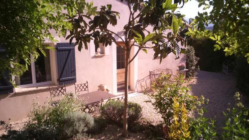 a small tree in front of a house at "Le Vent d'Étoile" B&B and Guesthouses in Mormoiron