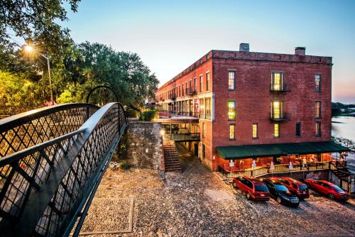 a group of cars parked in front of a building at River Street Inn in Savannah