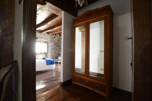 a room with a door leading to a bedroom at Txantxorena in Zubiri