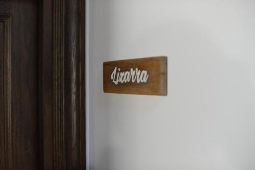 a sign on the side of a white refrigerator at Txantxorena in Zubiri