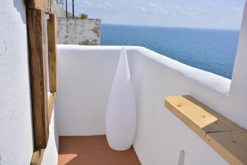 a balcony with a view of the ocean at Blancos Rooms Hotel in Peñíscola