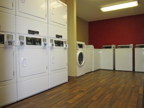 a laundry room with a bunch of white washers and dryers at Extended Stay America Suites - Seattle - Southcenter in Tukwila