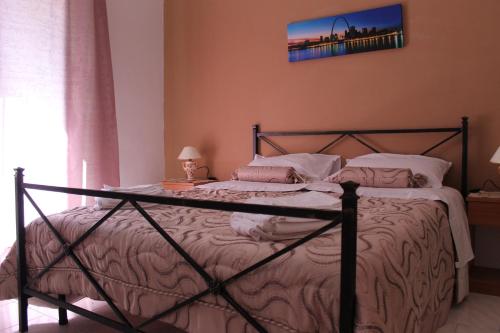 Katil atau katil-katil dalam bilik di Gisira Appartment