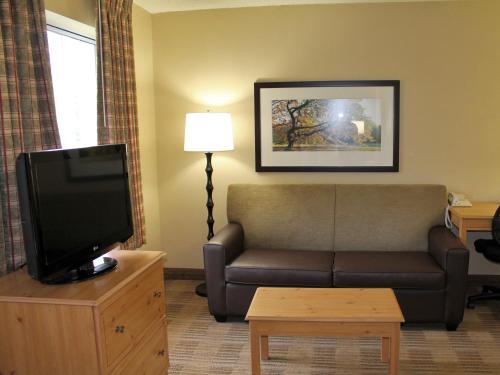 a living room with a couch and a tv at Extended Stay America Suites - Meadowlands - East Rutherford in East Rutherford