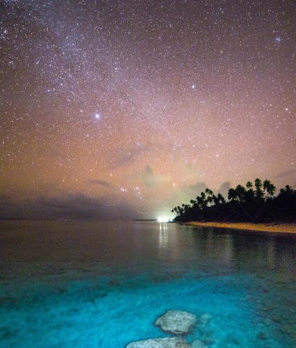a starry night over a body of water at Saletoga Sands Resort & Spa in Matatufu