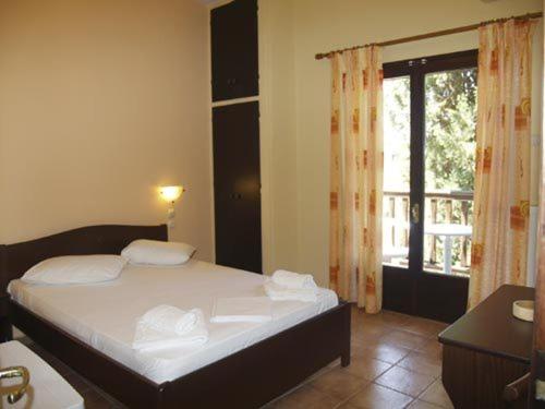 Postel nebo postele na pokoji v ubytování Hotel Figalia