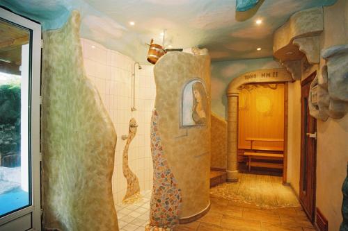 a bathroom with a large shower in a room at Märchenhotel 3 Sterne Superior Waldpension Nebelstein in Harbach