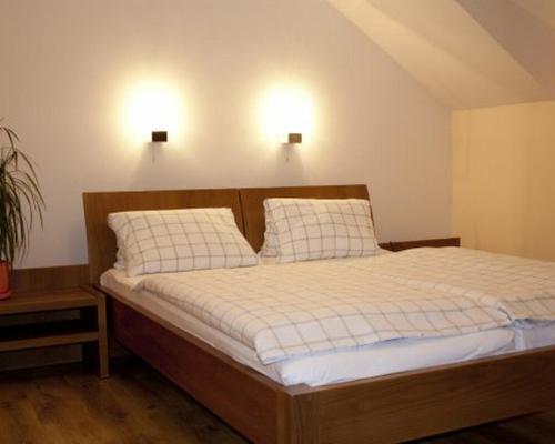 Llit o llits en una habitació de Penzion Rami