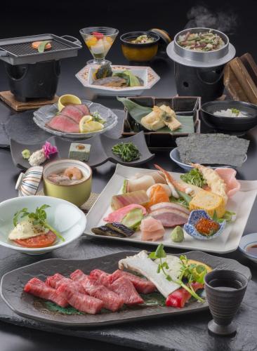 a table with many plates of food on it at Nakamurakan in Takayama