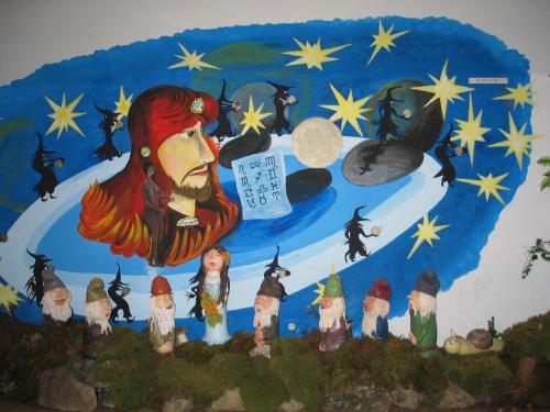 a wall with a painting of a woman and stars at Märchenhotel 3 Sterne Superior Waldpension Nebelstein in Harbach