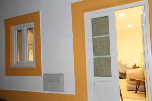 a door and a window in a room at 10 Boutique House in Alcochete