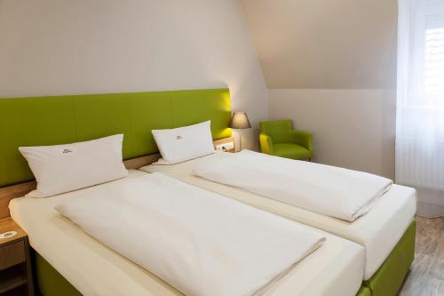 Säng eller sängar i ett rum på Hotel Engelbert