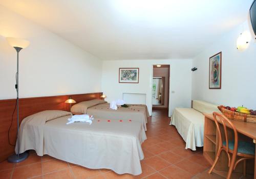 Postel nebo postele na pokoji v ubytování Hotel Marina 2