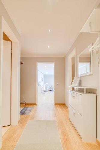 a kitchen with white cabinets and a staircase at Schöne Wohnung am Dresdner Zwinger in Dresden