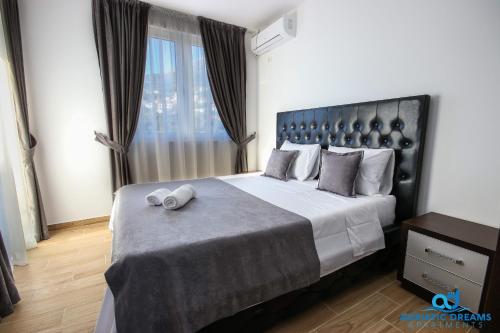 מיטה או מיטות בחדר ב-Adriatic Dreams Apartments