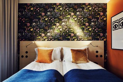 Postel nebo postele na pokoji v ubytování NOFO Hotel, WorldHotels Crafted