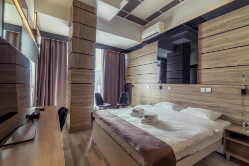 Postel nebo postele na pokoji v ubytování Hotel De KOKA