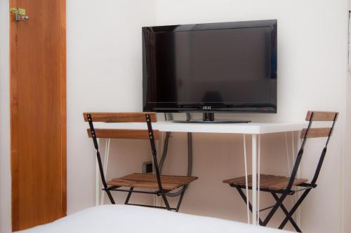 Televízia a/alebo spoločenská miestnosť v ubytovaní Magione Serra