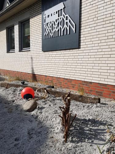 a building with a sign on the side of it at Hus op de Diek in Sankt Peter-Ording