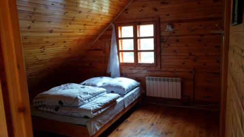 Posteľ alebo postele v izbe v ubytovaní Dom Wakacyjny u Chmiela