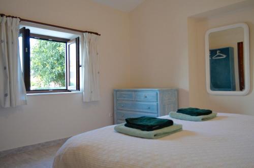 מיטה או מיטות בחדר ב-Boa Vista