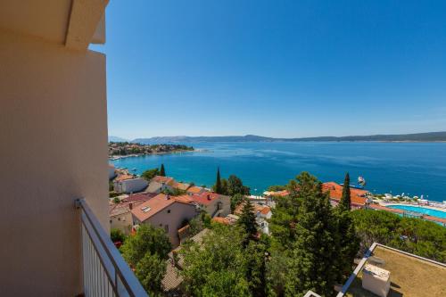 a view of a town and a lake from a building at Hotel Katarina in Selce